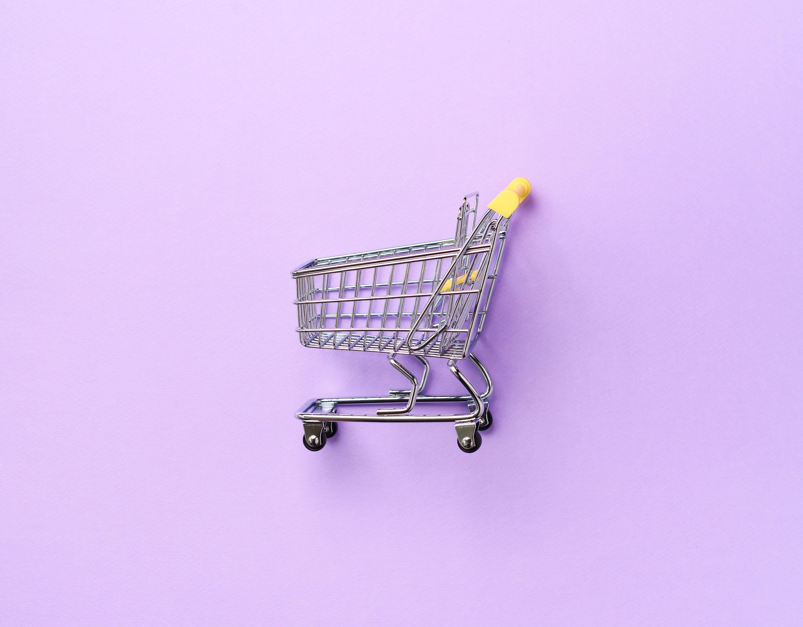 shopping-cart-on-purple-background-minimalism-styl-RYJLQTG (1)